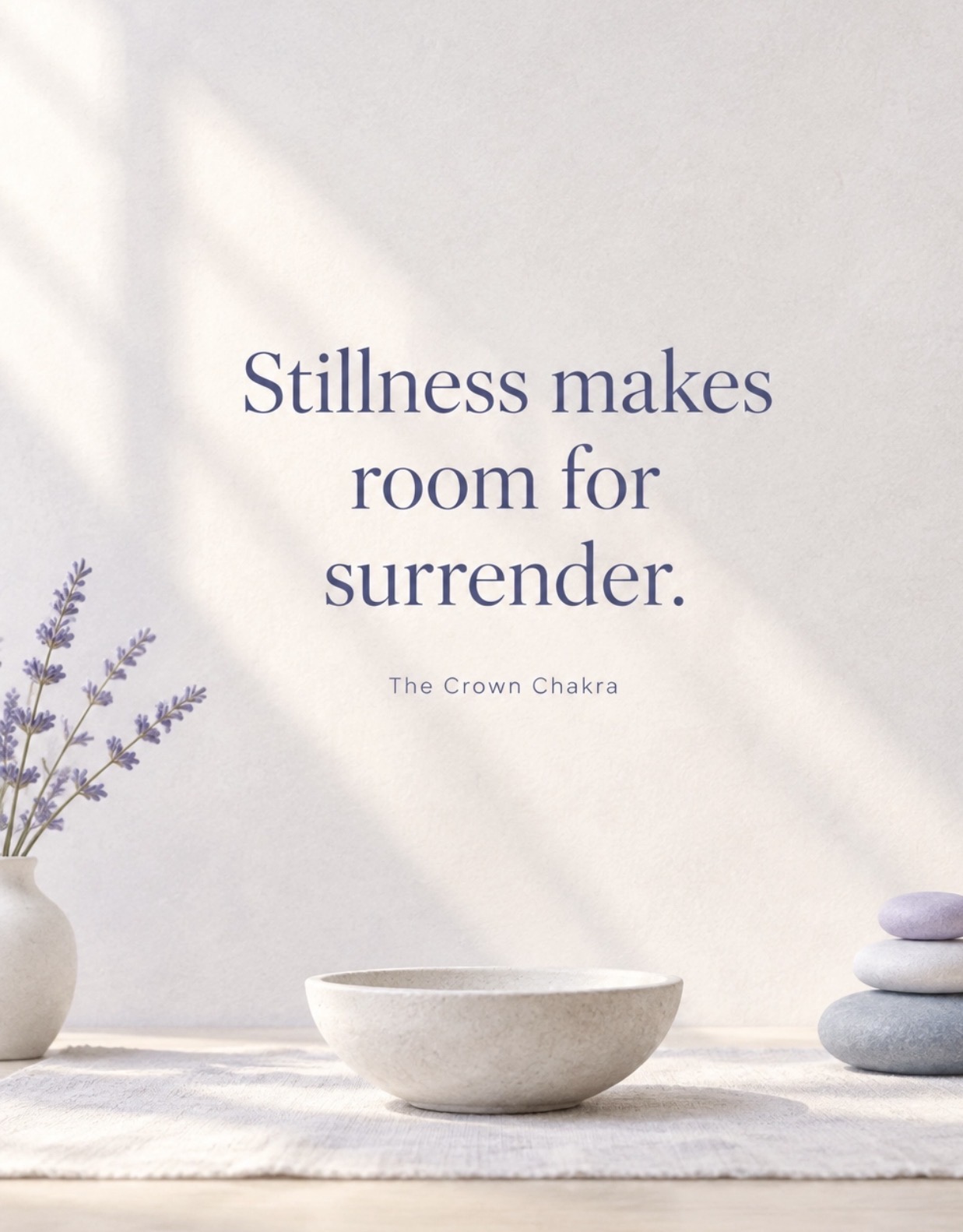 A serene still-life with lavender, stacked stones, a meditation bowl, and the words Stillness makes room for surrender